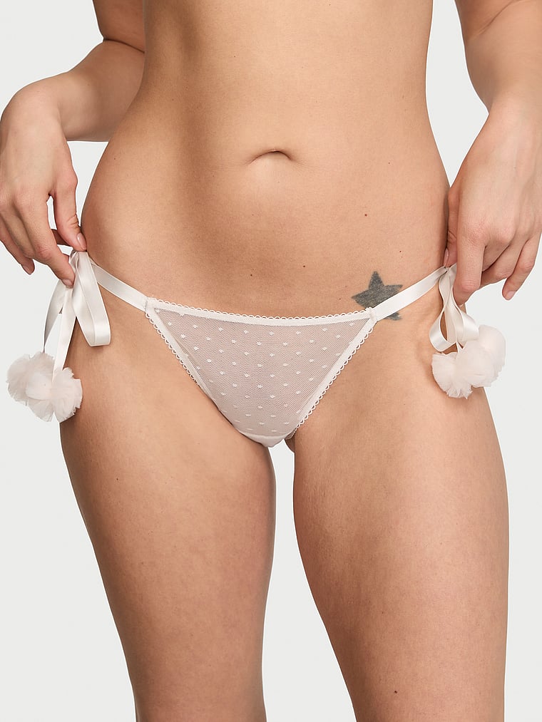 Victoria's Secret, Dream Angels Bridal Tulle Ruffle Pom-Pom String Bikini Panty, Coconut White, onModelFront, 1 of 4 Kiana is 5'9" and wears Small