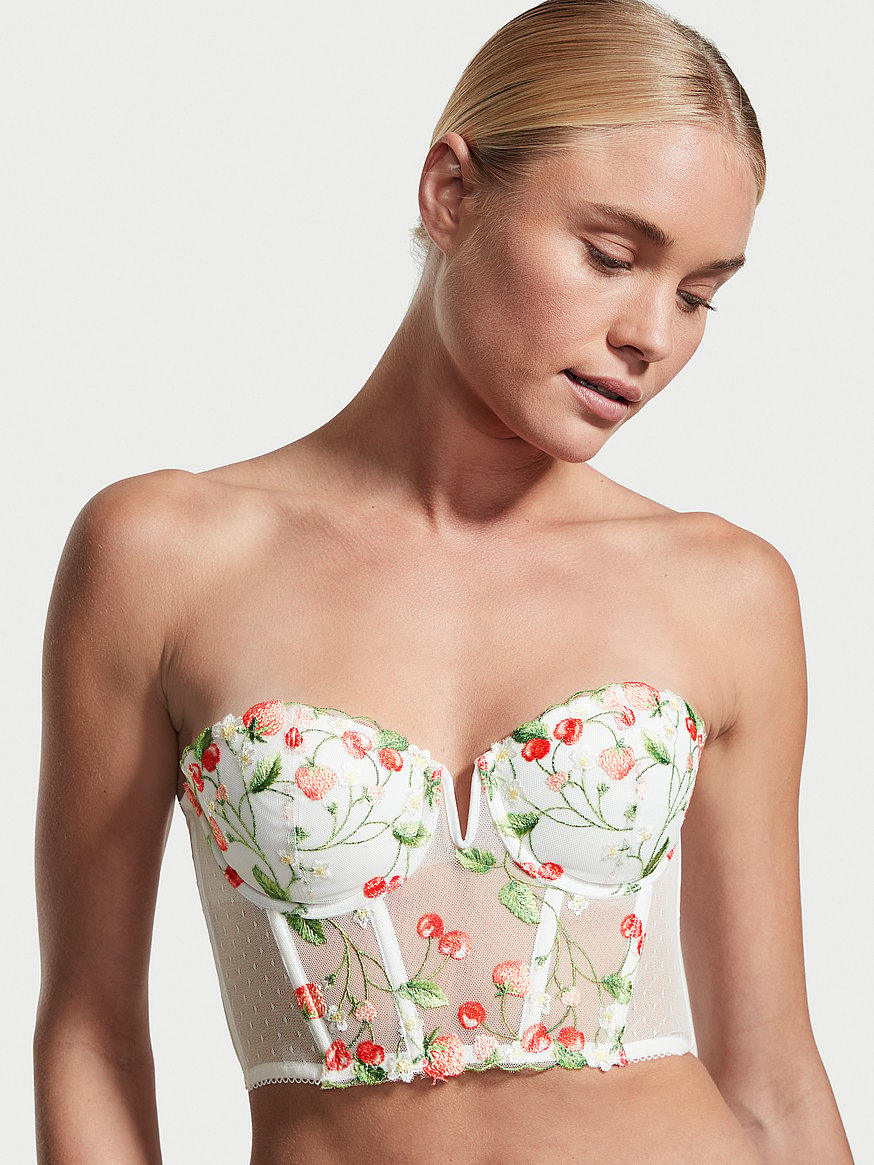 Equal parts fruity and fun, embroidered Dream Angels corset tops are the  cherry on top of every summer look.