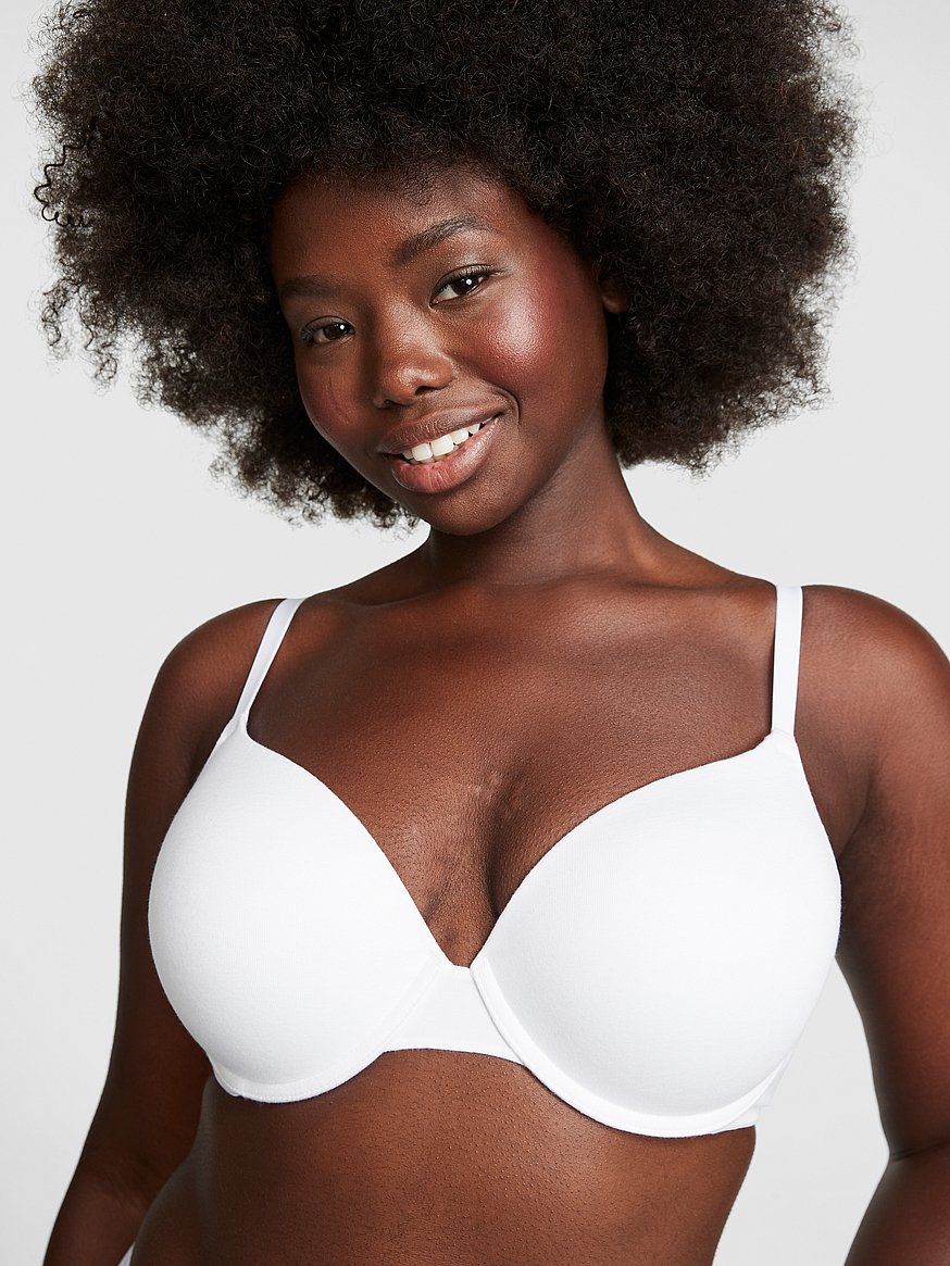 White cotton bra on pink background. Concept, feminine brassiere
